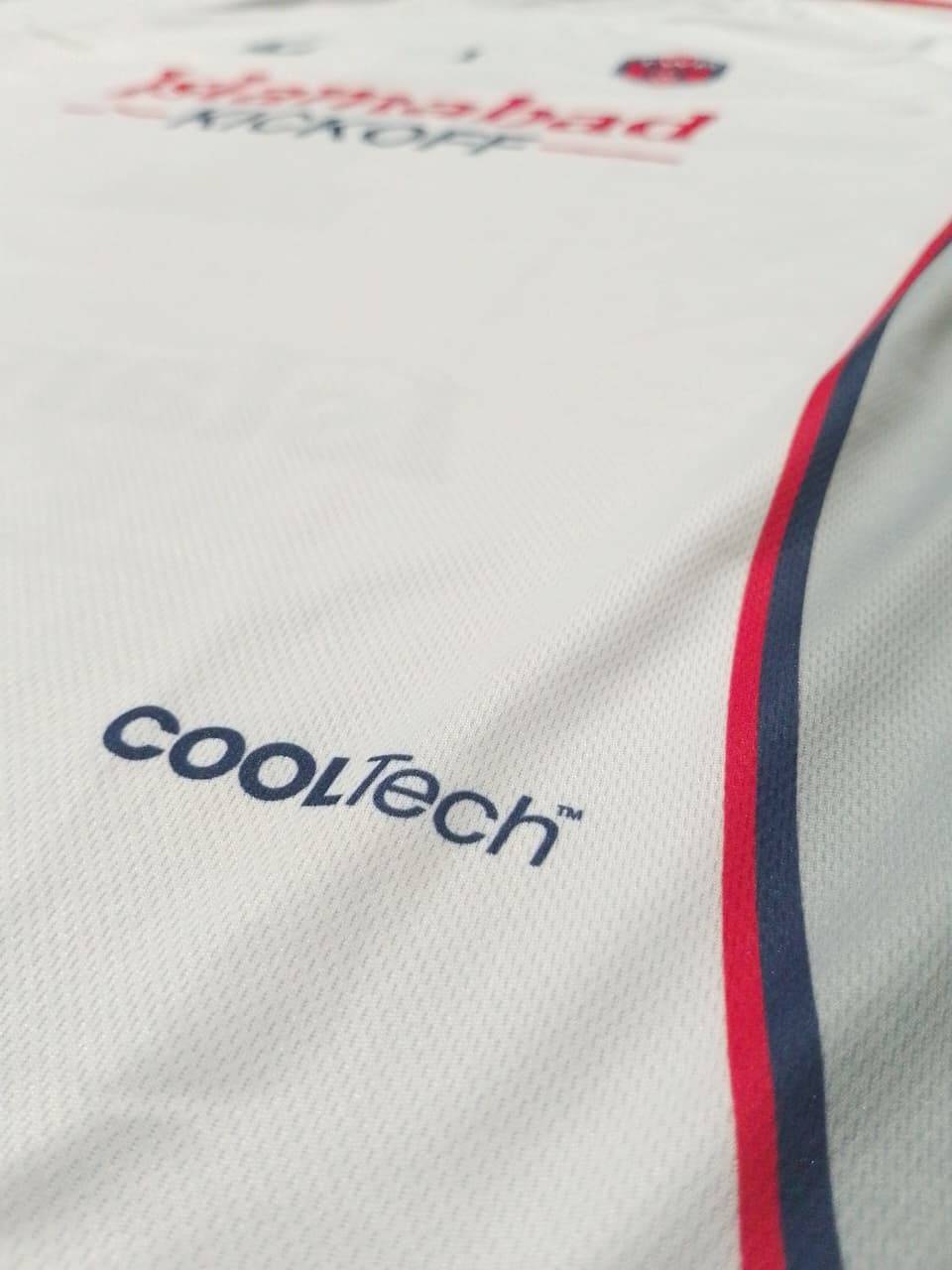 Macro shot of the CoolTech mesh panel on the white away shirt