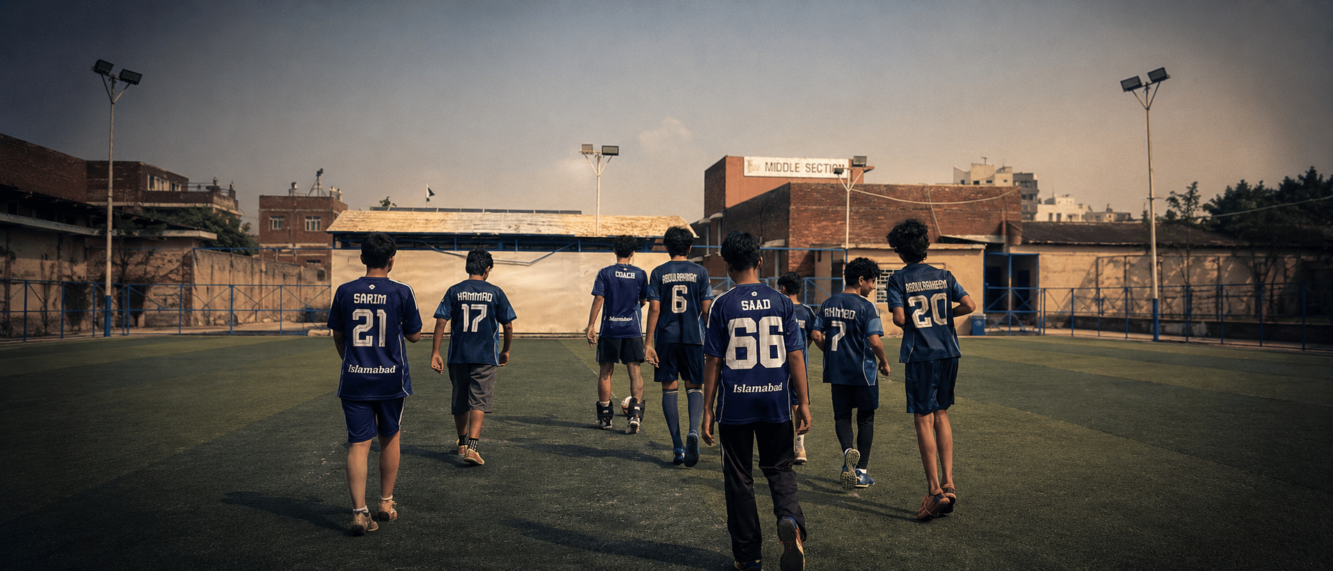 The TWA FC squad walking out onto the pitch together before a session